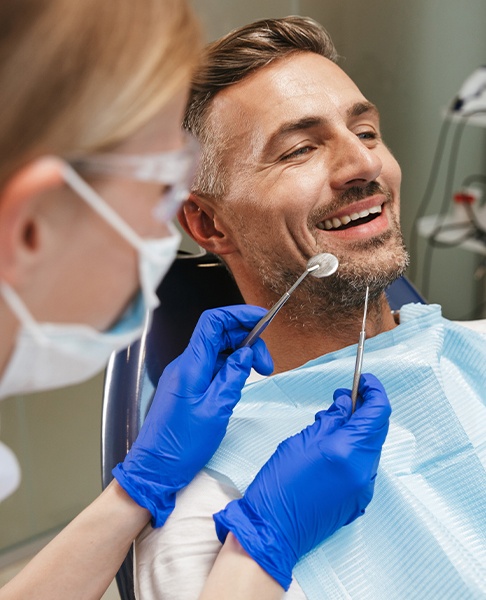 Man receiving dental checkup to prevent dental emergencies