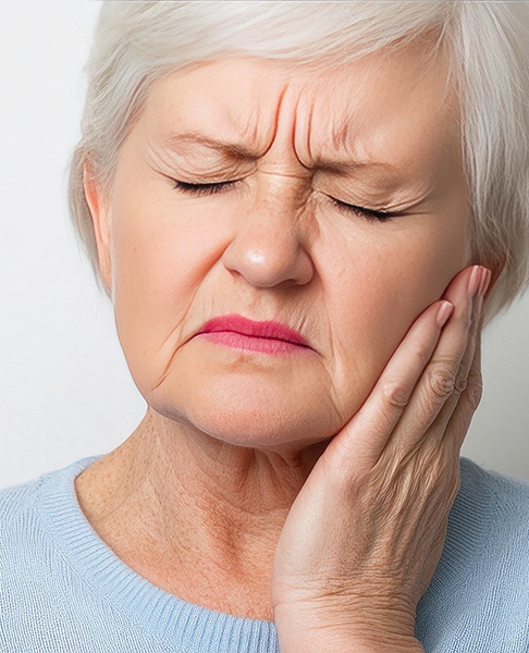 Senior woman experiencing mouth pain